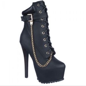 NWB Black heel boots with chain. Never worn.